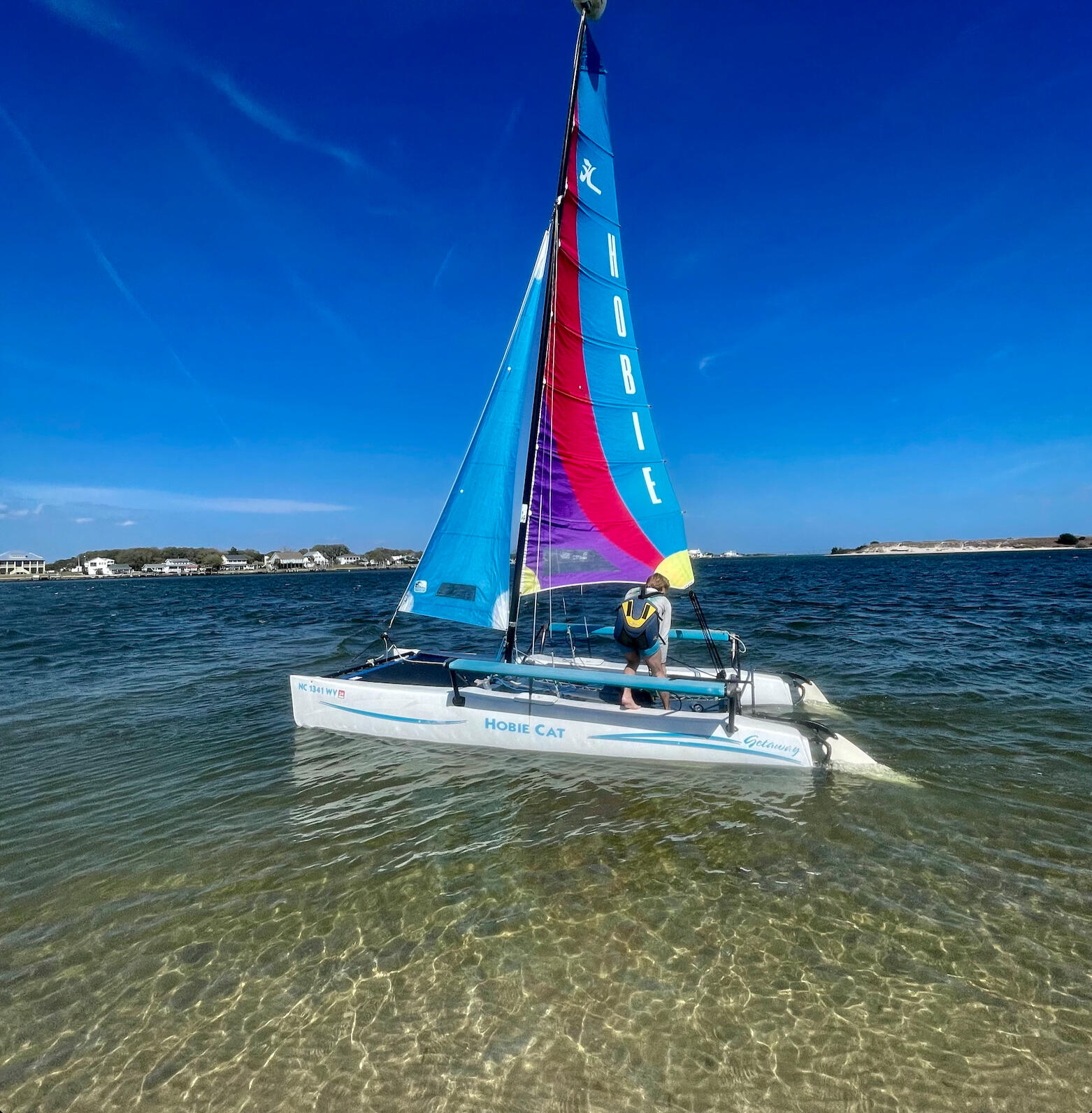 Captain Zach sailing a Hobie Cat catamaran on the Intracoastal Waterway